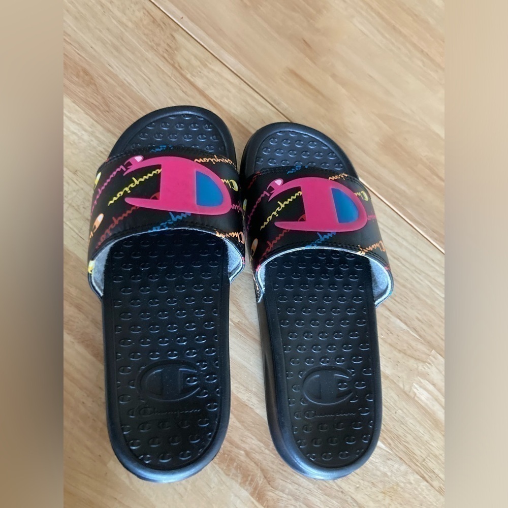 4/$25 Champion slides in 4Y. Black with pink, blue & yellow accents